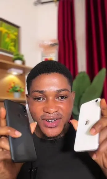 Free phone customer 1 holding the free smartphone they received