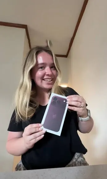 Free phone customer 4 holding the free smartphone they received