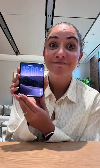 Free phone customer 9 holding the free smartphone they received
