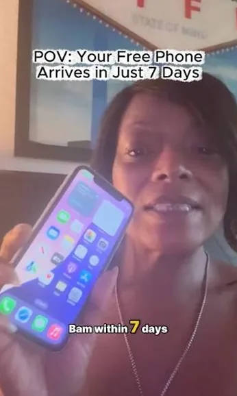 Free phone customer 10 holding the free smartphone they received