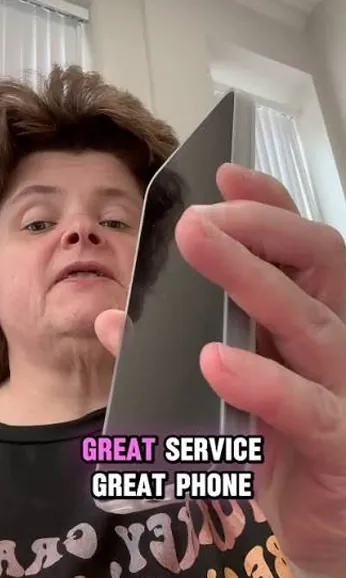 Free phone customer 15 holding the free smartphone they received